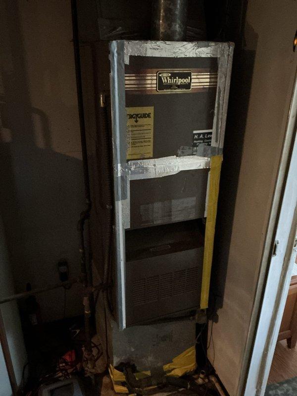 Responded to service call for non-functional thermostat on 20-year-old York air conditioning system with Whirlpool furnace. Replaced failed thermostat with basic non-programmable unit per homeowner request. Verified proper system operation and thermostat communication with HVAC equipment following installation. System restored to normal functionality with heating and cooling capabilities confirmed operational.