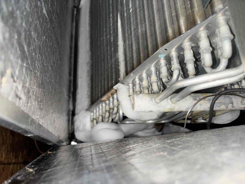 Responded to service callback for HVAC system failure following previous low voltage wire repair. Upon arrival, system remained non-operational despite prior technician's work. Performed comprehensive diagnostic assessment of unit including visual inspection of heat exchanger coils, refrigerant lines, and electrical components. Connected Fieldpiece SMAN manifold gauges to measure system pressures and temperatures, recording readings of 446 PSI low side and 1396 PSI high side with superheat at 546°F. Inspected copper refrigerant lines with foam insulation showing wear and discoloration. Examined condenser coil fins which displayed dust accumulation and typical outdoor equipment wear. Documented all findings with detailed photographs of internal components, pressure readings, and system conditions for accurate service records and potential warranty claims. System issue persists and requires further troubleshooting to identify root cause beyond initial low voltage wiring concern.