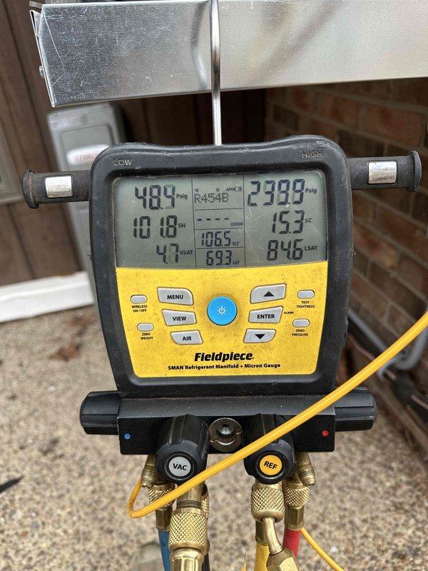 Responded to callback for two newly installed Lennox systems experiencing cooling issues due to suspected refrigerant leaks. Connected Fieldpiece SMAN manifold gauge to both units and verified R454B refrigerant pressures and subcooling levels. Referenced manufacturer installation manual to confirm proper indoor unit match-ups and factory-specified subcooling charge requirements for TXV systems with 15-foot line sets. Systems currently operational for heating mode but require refrigerant leak diagnosis and repair to restore cooling functionality.