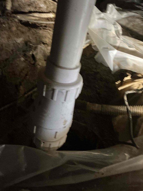 Installed new PVC drainage piping system in attic crawl space, including horizontal drain lines with proper elbow fittings and flexible trap connections. Routed white electrical wiring and coordinated installation with existing mechanical systems including flexible ductwork and vapor barrier materials to ensure proper clearances and code compliance.