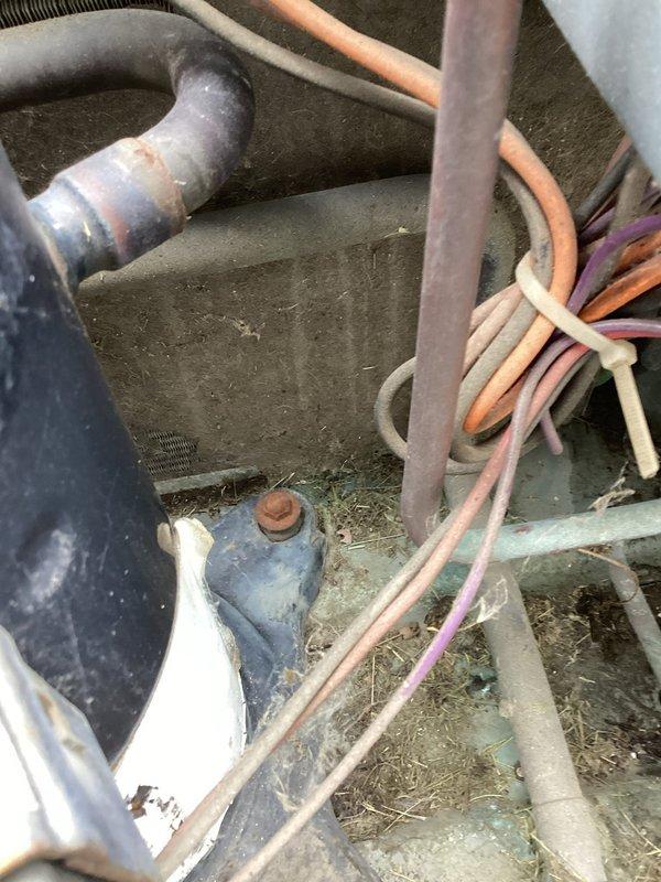 Responded to no cooling complaint on 10-15 year old central air conditioning system. Upon arrival, performed diagnostic testing on outdoor condensing unit using multimeter to check electrical components including dual capacitors and compressor motor. Disassembled exterior panels to access internal components and inspect condenser coil, which showed significant dust and debris accumulation. Evaluated wire connections, refrigerant lines, and fan motor assembly for proper operation. Unit displayed signs of age-related wear and required cleaning of heavily soiled base pan and internal components to restore proper airflow and system efficiency.