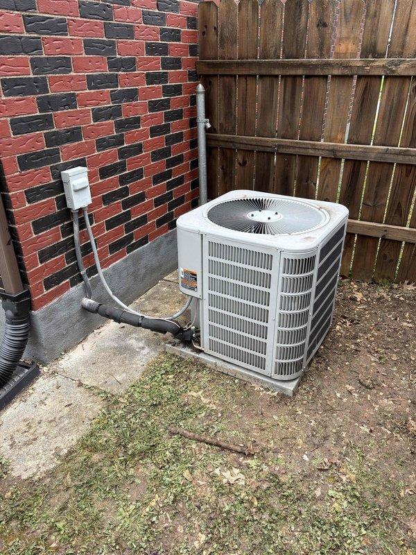 Relocated outdoor air conditioning condenser unit to new position adjacent to brick wall. Disconnected refrigerant lines, electrical connections, and condensate drain from original location. Moved unit and reinstalled on existing concrete pad. Reconnected all electrical conduit, PVC piping, and refrigerant lines to unit. Verified proper placement, secured all utility connections, and ensured unit was level and stable on pad. System repositioned successfully with all connections intact and operational.