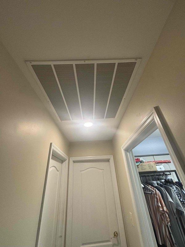 Completed follow-up visit to install return air grille in hallway ceiling and install breaker panel blanks in electrical panel to fill unused breaker slots. All work performed per code requirements and system is operating properly.