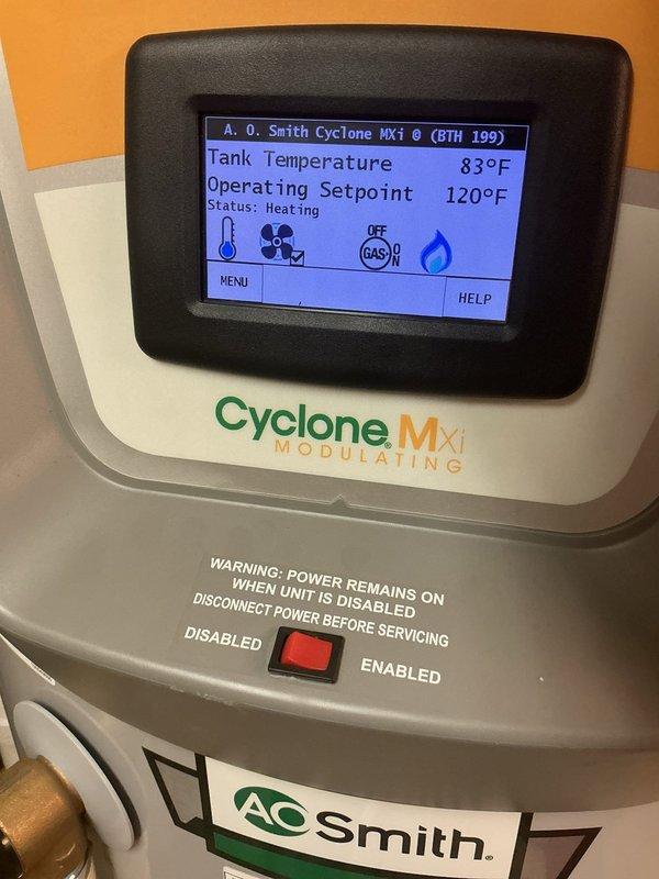 Responded to service call for A.O. Smith Cyclone MXi modulating water heater experiencing ignition failure and flame retention issues. Upon inspection, diagnosed faulty blower motor assembly preventing proper combustion air flow, which triggered lighting error codes and prevented unit from maintaining flame. Replaced defective blower motor, tested ignition sequence, verified proper flame operation, and confirmed unit returned to normal heating cycle with tank temperature rising appropriately to setpoint of 120°F.