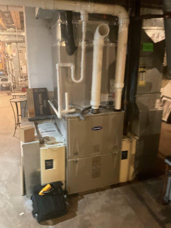 # HVAC Service Completed

Responded to no cooling complaint on residential split system over 10 years old. Upon arrival, performed diagnostic evaluation of outdoor condensing unit and indoor air handler system. Completed repairs per approved estimate to restore cooling operation.

Serviced dual outdoor condenser units located on exterior concrete pads. Addressed cooling system failure through systematic troubleshooting of refrigeration circuit, electrical components, and mechanical systems. Inspected Carrier furnace and associated air handler equipment in basement utility area. Verified proper operation of all HVAC controls and safety devices.

Completed necessary repairs to condensing unit including component replacement as specified in estimate. Tested system performance following repairs. Confirmed adequate airflow through evaporator coil and proper refrigerant pressures. Verified electrical connections secure at both outdoor and indoor equipment. System restored to normal cooling o