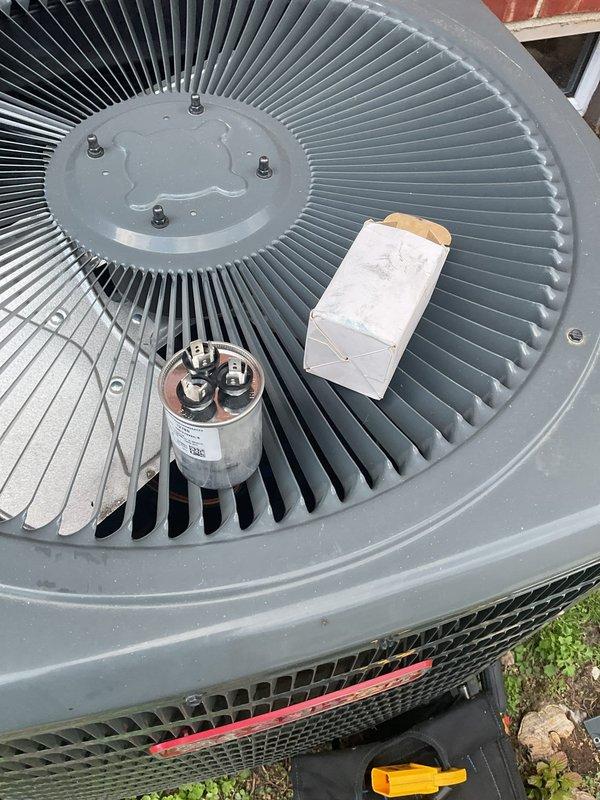 Responded to no cooling complaint on 15-year-old residential air conditioning system. Upon inspection, diagnosed failed dual-run capacitor preventing compressor and condenser fan operation. Replaced defective capacitor with new unit, restoring full system functionality. Verified proper operation at thermostat showing 76°F display, confirmed cooling cycle initiation, and tested both compressor and outdoor fan motor performance. System returned to normal cooling operation.