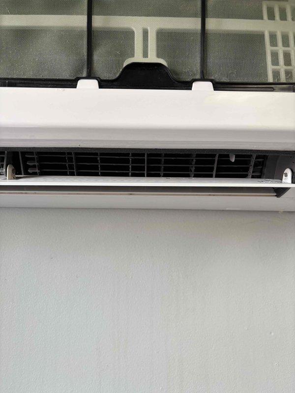 Performed diagnostic inspection on mini-split indoor unit located in basement closet. Opened front panel and accessed evaporator coil assembly to assess cleaning requirements. Identified need for AprilAire 35 humidifier pad replacement on associated system. Documented internal components including horizontal fin arrangement and air distribution louvers. Part has been ordered for follow-up installation, estimated completion time of 60 minutes upon arrival. System currently operational (green priority status). Captured photographic documentation of unit interior and coil condition for service records.