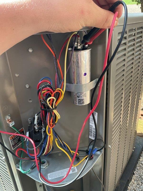 Completed follow-up maintenance visit to verify system performance after previous service call. Performed diagnostic testing on HVAC unit, including capacitor testing with multimeter to confirm proper electrical function and system charging levels. Verified thermostat operation showing system actively cooling from 78°F to setpoint of 75°F. Confirmed unit running properly with all components functioning as designed.