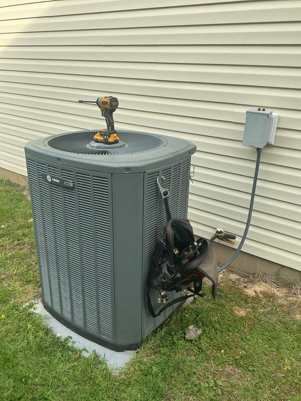 Responded to customer concern regarding loud screeching noise from 15-year-old Trane condenser unit. Upon inspection, diagnosed failing condenser fan motor bearing as source of noise. Performed diagnostic testing and service work on outdoor unit, accessing refrigerant lines and electrical components to complete repair. Unit restored to normal operation with noise eliminated.