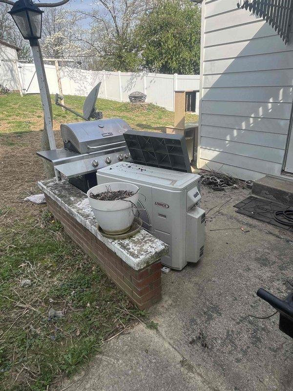 Successfully removed ductless mini-split system from residential property, including outdoor condenser unit, indoor air handler, refrigerant line set, condensate drain lines, and electrical disconnect. All components were properly recovered and disconnected from the building exterior, with electrical conduit and mounting hardware removed from vinyl siding per customer request for system relocation.