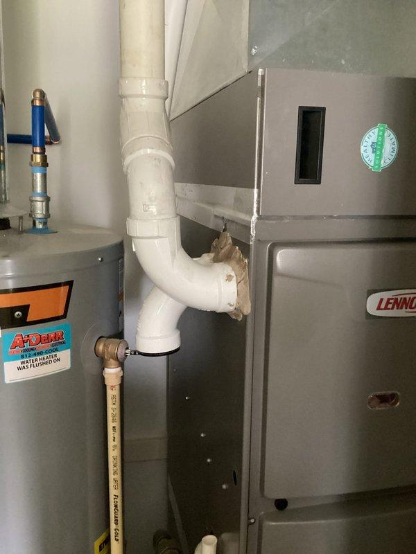 Completed follow-up visit to repair duct seals on furnace exhaust and intake connections. Inspected Lennox furnace installation, resealed PVC intake and exhaust piping at connection points to ensure proper airtight operation, and verified system functionality upon completion.