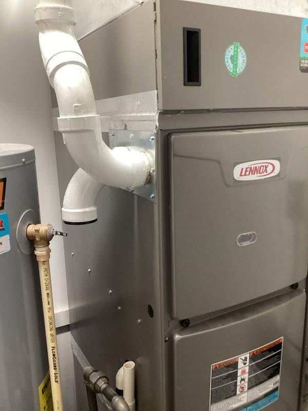 Completed follow-up visit to repair duct seals on furnace exhaust and intake connections. Inspected Lennox furnace installation, resealed PVC intake and exhaust piping at connection points to ensure proper airtight operation, and verified system functionality upon completion.