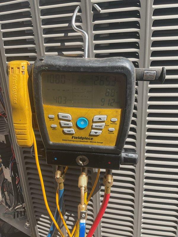 Responded to service call for outdoor unit access panel found unsecured and non-functioning thermostat on 3-year-old system. Performed diagnostic evaluation using refrigerant manifold gauges to assess system pressures and operational parameters. Secured exterior panel on condensing unit and addressed thermostat malfunction. Delivered 20x20x4 air filter to property. System restored to proper heating operation with all components functioning as designed.