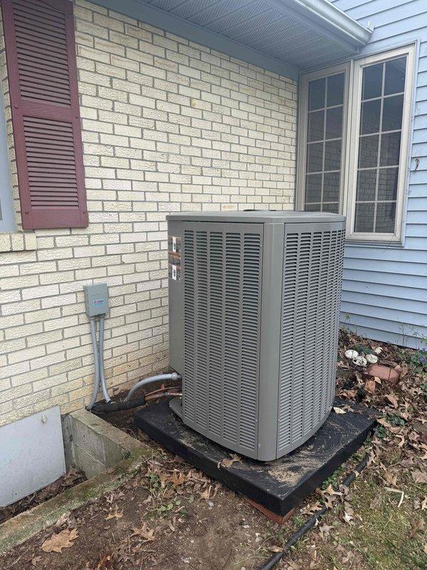 Completed full HVAC system installation including a 4-ton, 18 SEER air conditioning unit paired with a 97% efficiency furnace. The installation included subfloor plenum configuration with proper ductwork integration. The outdoor condenser unit was positioned on a composite equipment pad with adequate clearance from the structure, electrical disconnect installed on exterior wall with appropriate conduit routing, and all refrigerant lines properly insulated and secured.