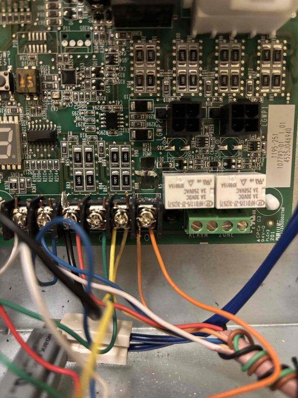 Responded to service call for non-operational heat pump system. Upon arrival, accessed the unit's control board and performed diagnostic testing of the electronic components and control circuits. Inspected the printed circuit board, relay switches, and terminal connections, documenting the condition of all wiring and control components with detailed photographs. Verified proper voltage at terminal blocks and confirmed all wire connections were secure at the control board interface. System was successfully restored to operational status and tested for proper heating function.