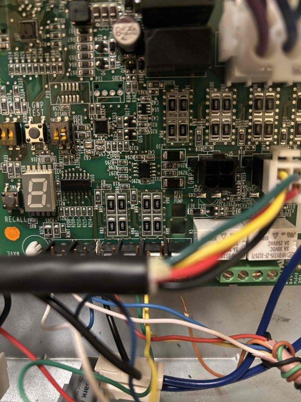 Responded to service call for non-operational heat pump system. Upon arrival, accessed the unit's control board and performed diagnostic testing of the electronic components and control circuits. Inspected the printed circuit board, relay switches, and terminal connections, documenting the condition of all wiring and control components with detailed photographs. Verified proper voltage at terminal blocks and confirmed all wire connections were secure at the control board interface. System was successfully restored to operational status and tested for proper heating function.