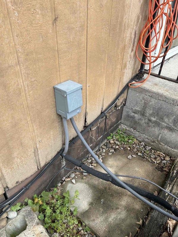 Conducted comprehensive assessment of existing American Standard Allegiance 13 SEER outdoor condensing unit manufactured in 2007. Documented current system specifications including model 24YR303QA1000AA operating at 200/230V with 13.0 amp circuit capacity. Evaluated electrical infrastructure including exterior disconnect box, conduit routing, and power supply connections. Photographed equipment nameplate data and existing installation conditions to provide detailed replacement estimate for upgraded high-efficiency HVAC system.