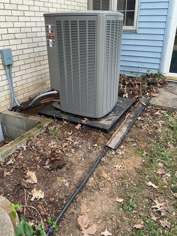 Performed follow-up service call to address continuous fan operation issue on outdoor HVAC condensing unit. Conducted system inspection and documented equipment condition with site photographs showing unit positioned on concrete pad against exterior wall with electrical conduit and refrigerant line connections visible. Addressed outstanding work items from previous installation to resolve fan control malfunction.