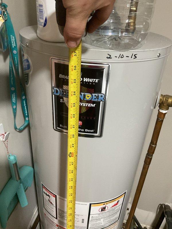 Completed comprehensive HVAC system evaluation for heat pump replacement estimate at residential property. Performed refrigerant leak detection assessment on primary heat pump system and conducted full inspection of secondary garage unit. Documented equipment specifications and measurements of existing Carrier furnace unit and Bradford White water heater (dated 2-10-15) to determine replacement requirements and clearance specifications. Provided detailed replacement estimate with equipment recommendations based on current system age and operational status.