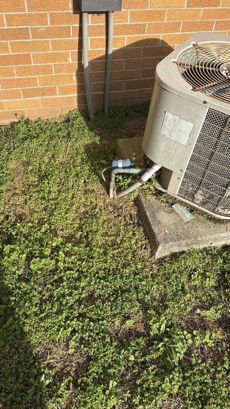 Conducted on-site assessment of 16-year-old residential air conditioning system to provide replacement estimate. Inspected existing outdoor condensing unit positioned on concrete pad adjacent to building exterior, noting current refrigerant line configuration, electrical disconnect placement, and PVC condensate drainage routing. Evaluated indoor HVAC system layout using downflow configuration diagram to determine proper sizing and clearance requirements for new equipment installation, including furnace, evaporator coil, and base specifications. Documented existing installation conditions through photographic records for accurate equipment selection and proposal preparation.