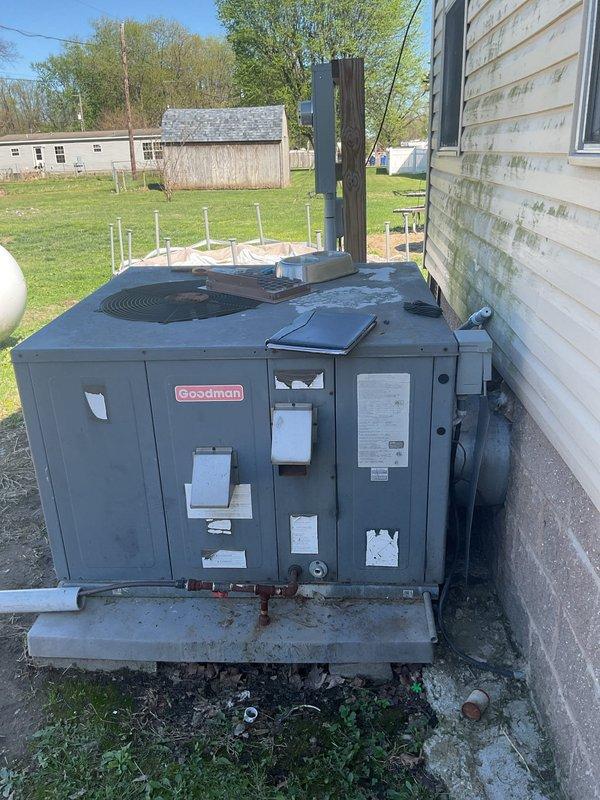Conducted comprehensive assessment of existing packaged heat pump unit serving medium-sized residential structure. Evaluated current Goodman package unit installation, electrical disconnect components, and meter configuration for replacement estimate. Documented equipment specifications, unit placement on concrete pad, electrical service connections, and overall system condition to provide A+ rated energy-efficient replacement recommendation for heating and cooling system upgrade.