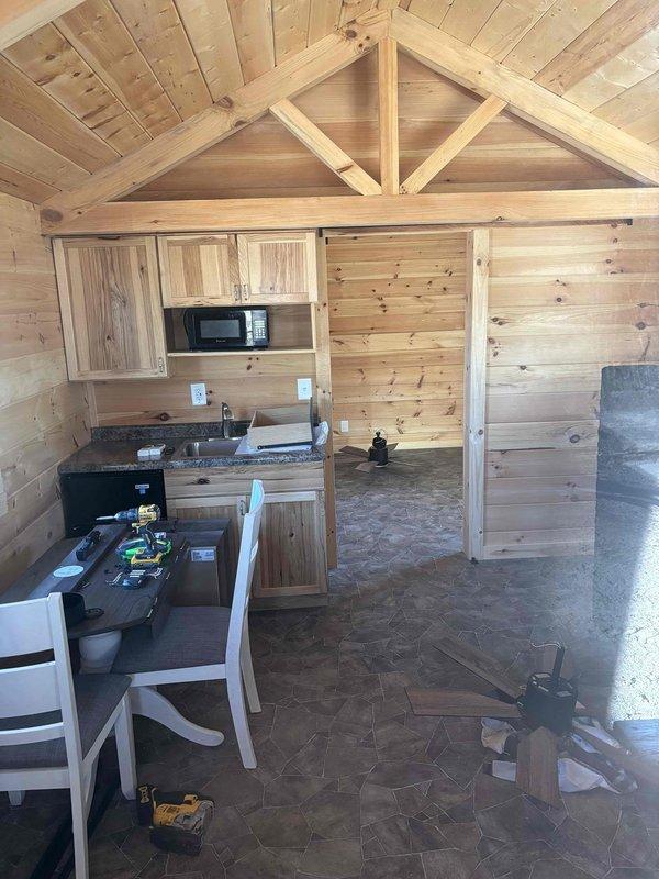 Completed HVAC replacement estimate for two newly constructed cabin units at a campground facility. Assessed interior spaces with vaulted ceilings and exposed timber framing to determine optimal equipment sizing and ductwork routing for complete system installation. Evaluated existing conditions including moisture accumulation on metal surfaces and documented structural layout to provide comprehensive replacement system recommendations for properties with no current HVAC equipment installed.