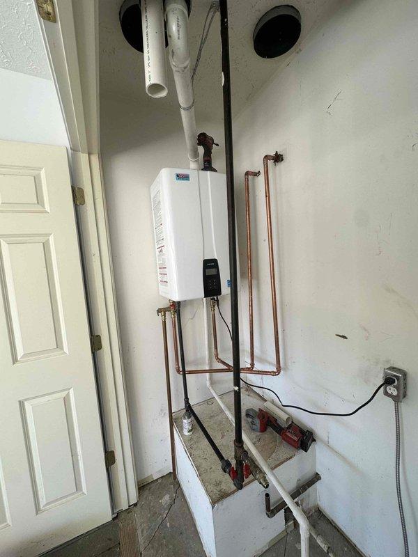 # HVAC Installation Completed

Successfully installed a 9,000 BTU ductless mini-split air conditioning system in a covered outdoor patio area. The installation included mounting the indoor evaporator unit on the brick wall, running refrigerant lines concealed in white PVC line cover, establishing proper drainage, and completing all electrical connections to code. System was tested and verified operational upon completion.