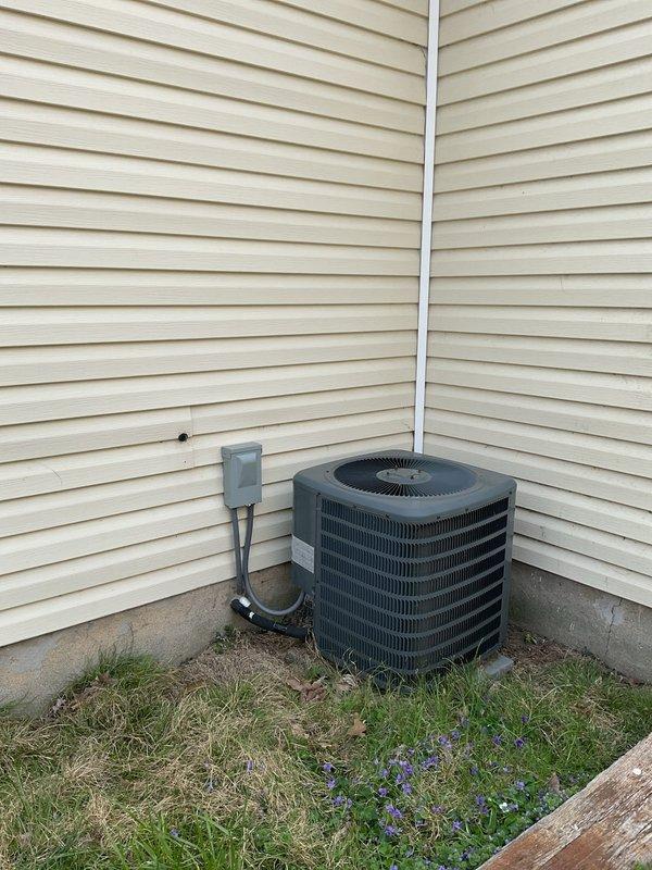 Conducted comprehensive replacement estimate for residential HVAC system including non-operational gas furnace from early 2000s and 2013 air conditioning unit. Assessed existing outdoor AC unit with cylindrical configuration, electrical disconnect, and PVC condensate drainage, along with gas meter infrastructure and utility connections at brick foundation. Documented current equipment condition, measured installation space requirements, evaluated electrical service capacity, and provided complete system replacement recommendations for both heating and cooling components.