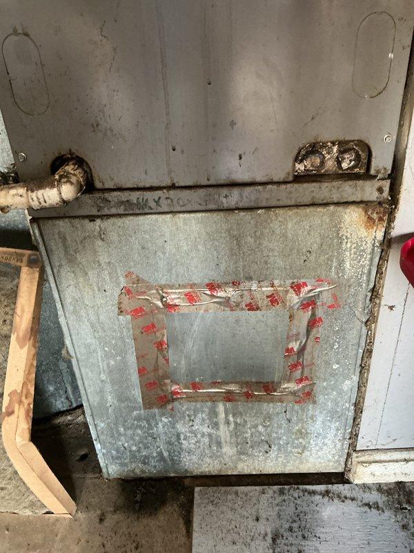 Responded to no cooling complaint on residential split system over 10 years old with airflow present but no temperature drop. Upon inspection, found outdoor condenser unit operational and evaporator coil with significant corrosion and deterioration to cabinet and components. Diagnosed system failure due to age-related component degradation and recommended full system replacement given the advanced deterioration of equipment and age of unit exceeding typical service life.