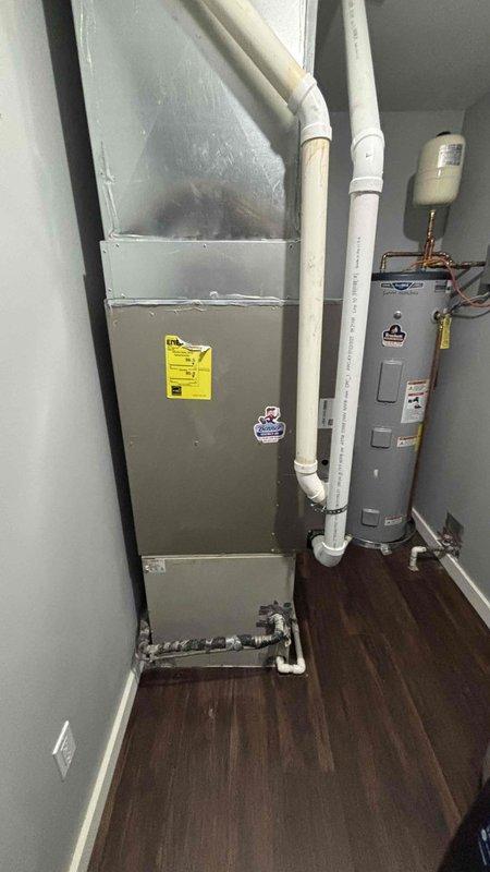 Conducted on-site evaluation for air conditioning system replacement at single-family residence. Assessed existing 1998 air conditioning unit, confirmed non-operational status and determined complete system replacement required. Inspected 2021 furnace installation in utility room, verified proper operation and compatibility for new AC integration. Documented existing ductwork configuration including ceiling-mounted return air grille, evaluated electrical service capacity, and photographed current HVAC equipment layout. Provided comprehensive replacement estimate for new air conditioning system installation utilizing existing furnace and ductwork infrastructure.