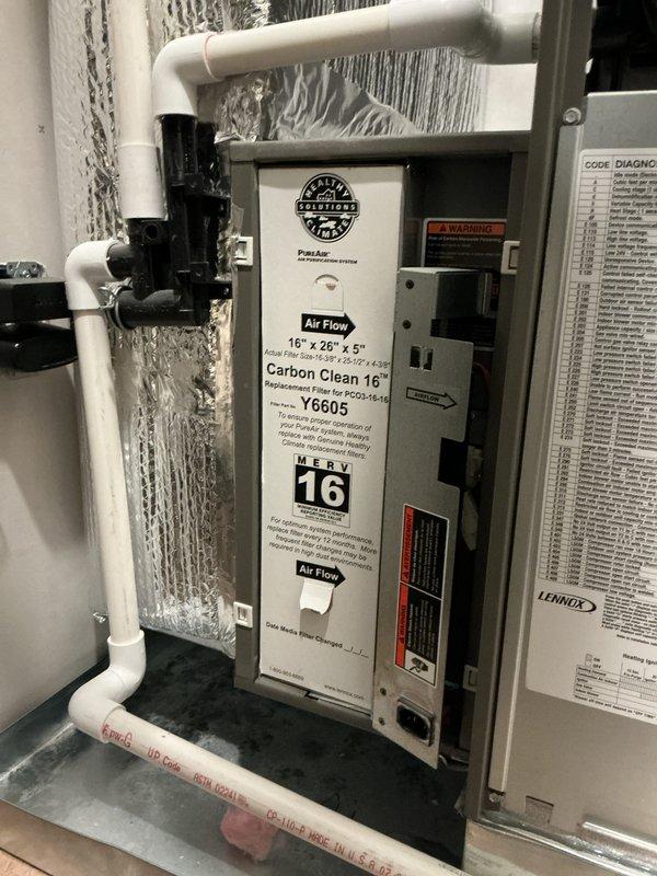 # HVAC Maintenance Summary

Completed platinum-level preventive maintenance on single-system residential HVAC installation. Inspected air handler unit with MERV 16 Carbon Clean air filter (16" x 26" x 5", model Y6605) and verified proper operation of control module with green indicator light showing active status. Examined electrical junction box connections, PVC condensate drain lines with functioning valves, and flexible aluminum ductwork installation over reflective insulation. All system components operating within normal parameters, documentation updated, and photographic records captured for service history.