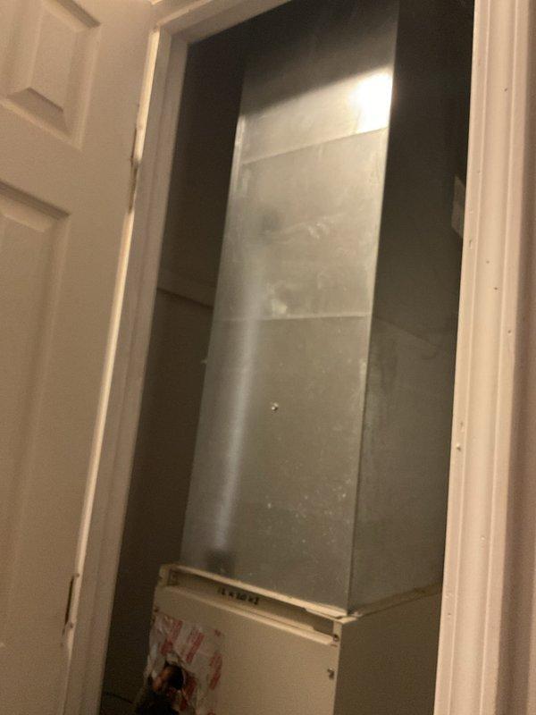 Conducted comprehensive replacement estimate for failed HVAC system with refrigerant leak and non-functional heat pump. Evaluated existing air handler installation in interior utility closet, documented equipment configuration including copper refrigerant lines, condensate drainage system, and ductwork connections. Assessed space constraints and existing infrastructure to provide complete system replacement recommendations, as customer declined repair options in favor of full equipment replacement.