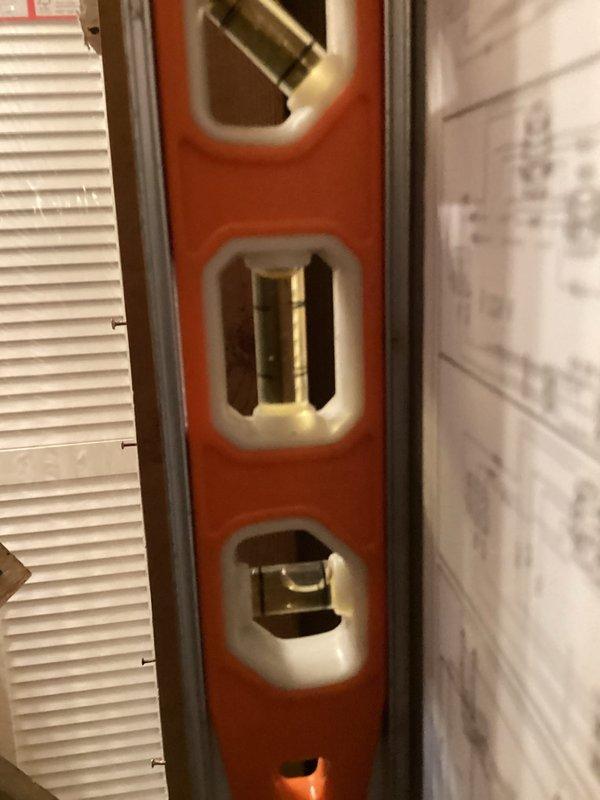 Completed first visit of quarterly planned maintenance on HVAC system with 17x21x5 filter specifications. Accessed furnace unit, verified proper installation positioning using level measurement tool, and documented equipment condition with manufacturer labels and service documentation clearly visible in compartment. Unit operating within normal parameters with all safety labels intact and accessible.