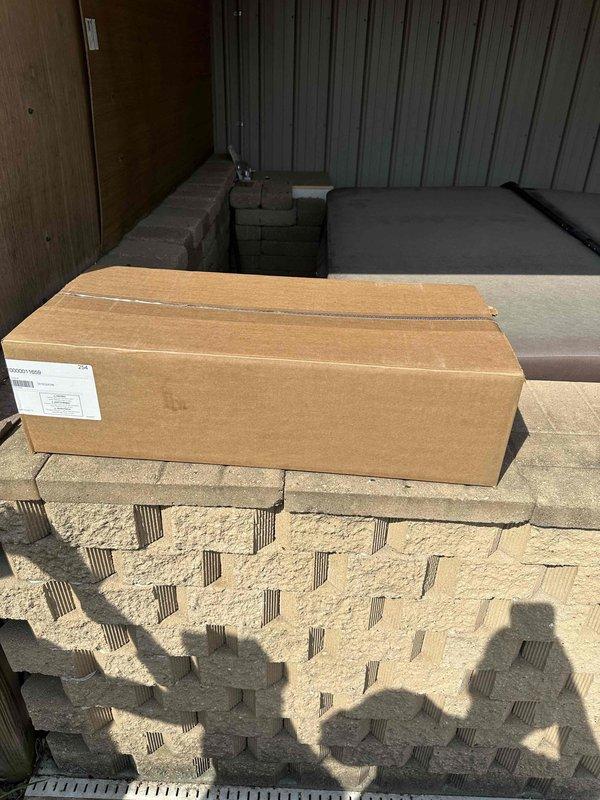 # Electrical Install - Generator

Successfully completed installation of a 26kW Generac standby generator system for residential application. Unit was mounted on a concrete pad adjacent to metal-sided building structure with proper clearances maintained per manufacturer specifications and local code requirements. Installed transfer switch and completed all necessary electrical connections from main service panel to generator unit. Black conduit runs were properly secured along building exterior to house electrical wiring between components. Generator cabinet positioned for optimal ventilation and serviceability access. System tested and verified operational, ready for automatic backup power operation during utility outages.