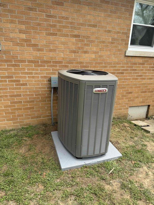 # HVAC Install - Complete System

Successfully completed installation of a complete 3-ton HVAC system with 18 SEER rating and 99% AFUE gas furnace. Installed Lennox outdoor condensing unit on concrete pad against exterior brick wall with proper clearances and secure mounting. Unit model SLFP99DF070XV36BK-01 installed indoors with all manufacturer labeling and safety notices properly affixed. Connected electrical service with external disconnect box mounted to building exterior. Verified proper refrigerant charge, tested all electrical connections, and confirmed system operation at design specifications. All equipment installed per manufacturer guidelines and local building codes.