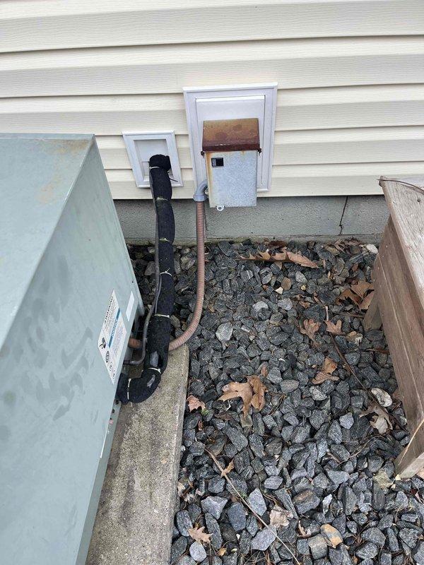 Completed replacement estimate for 30-year-old non-functional HVAC system. Assessed existing gray furnace unit with associated PVC venting and drainage lines in basement mechanical room, along with exterior condensing unit showing significant rust staining on access panel compartment. Customer requested replacement-only estimate with no repair options due to age and condition of equipment.