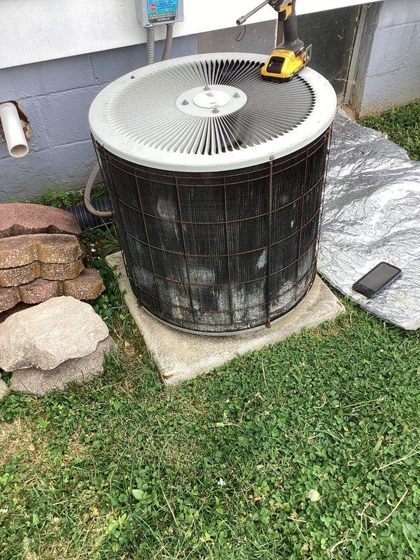 Responded to no-cool service call on 20+ year old residential air conditioning system. Customer reported unit running continuously without shutting off after reaching target temperature setpoint. Upon arrival, confirmed adequate airflow at supply registers with no visible ice formation on indoor coil or furnace area. Measured supply air temperature at 53°F using calibrated digital thermometer, indicating system producing cooling but experiencing control issues.

Inspected outdoor condenser unit and found equipment operational but showing age-related wear. Condenser coil exhibited moderate dirt accumulation and debris on exterior surfaces. Performed diagnostic evaluation of thermostat control circuit and cycling operation. System demonstrated continuous run condition consistent with thermostat malfunction or improper temperature differential settings preventing proper cycling.

Identified failed or malfunctioning thermostat as root cause preventing system from satisfying call for coolin