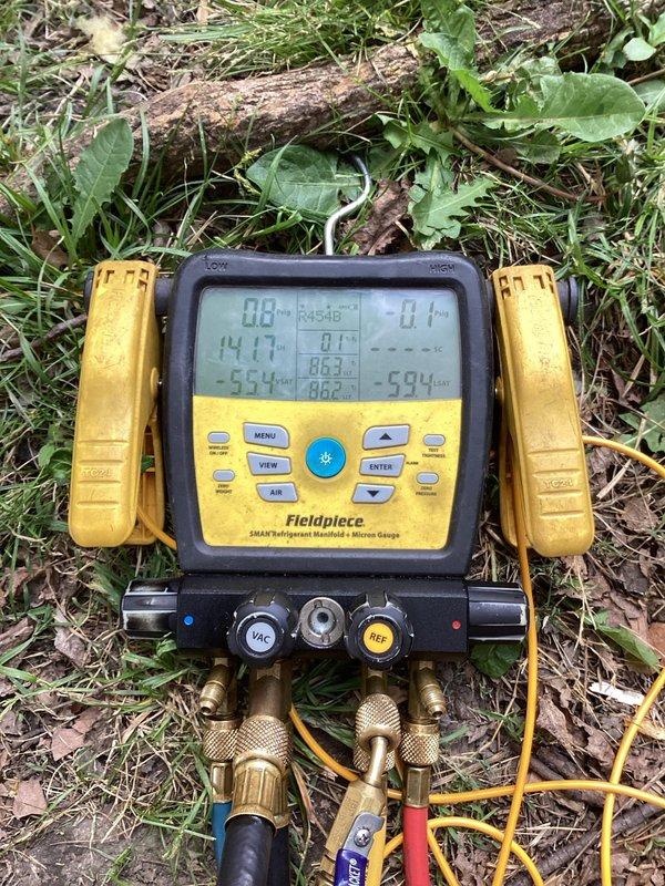 Responded to install callback for system not cooling adequately, with indoor temperature at 76°F while set to 72°F and unit running continuously while blowing warm air. Upon arrival, connected refrigerant manifold gauges and verified system pressures and charge levels using R454B refrigerant specifications. Referenced manufacturer charging information and torque specifications to diagnose refrigerant charge issue. System was properly charged to manufacturer specifications per unit nameplate data, restoring proper cooling operation and temperature control.