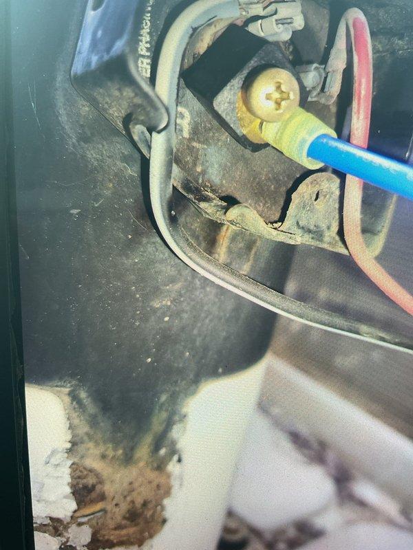 # HVAC Service Report

## Summary
Responded to no cooling complaint on residential air conditioning system. Diagnosed failed contactor with severely corroded contact points preventing compressor operation. Replaced defective contactor, verified proper system operation, and restored cooling functionality.

## Work Performed

Upon arrival, customer reported air conditioning system running but not producing cold air. Confirmed air handler operating normally with adequate airflow at registers. Proceeded to outdoor condensing unit to diagnose cooling failure.

Inspection of outdoor unit revealed condenser fan motor running but compressor not engaging. No visible refrigerant leaks, ice formation, or obvious external damage observed. Removed electrical service panel to access contactor and control components.

Visual inspection identified severely corroded contactor with rust-covered contact points and deteriorated connection surfaces. Corrosion extent indicated prolonged exposure to moisture