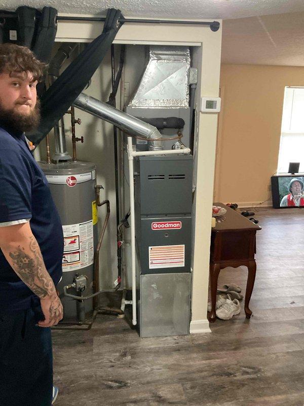 Responded to service call for 20-year-old air conditioning system blowing warm air in apartment unit. Performed comprehensive system evaluation of existing Goodman furnace and connected AC components located in basement utility closet. Upon inspection, determined that the aging system had reached end of serviceable life and recommended full HVAC replacement. Documented existing equipment configuration including ductwork, air handler, and furnace installation for replacement specifications. Provided customer with Red-level estimate for complete system replacement with A+ rated equipment to restore proper cooling function and improve energy efficiency.