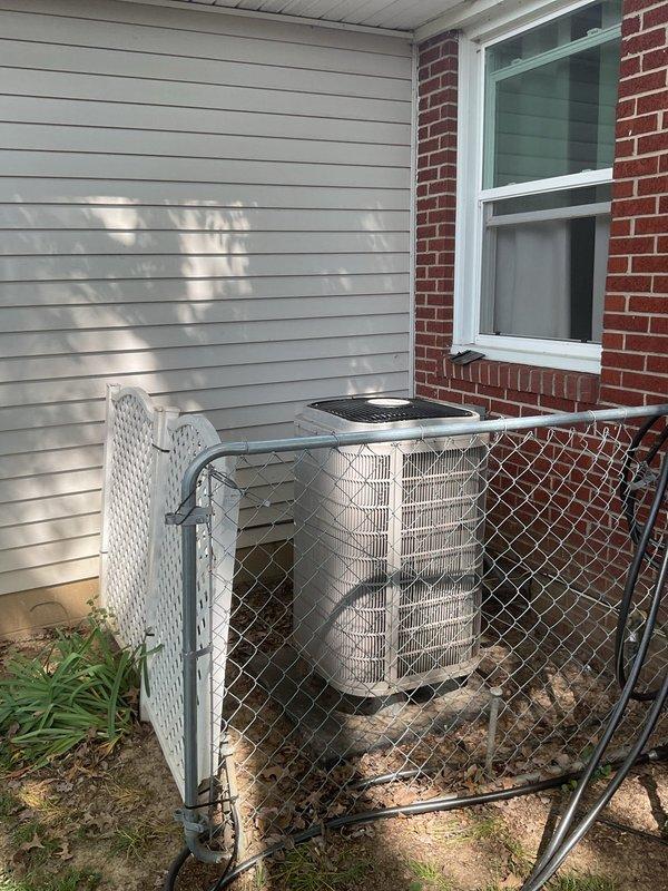Completed comprehensive replacement estimate for non-operational residential HVAC system requiring both heating and cooling equipment replacement. Assessed existing outdoor condensing unit with protective fencing and evaluated current thermostat wiring configuration including multi-wire connections at terminal points. Documented equipment specifications, reviewed installation requirements, and provided homeowner with complete system replacement options for both air conditioning and heating components.