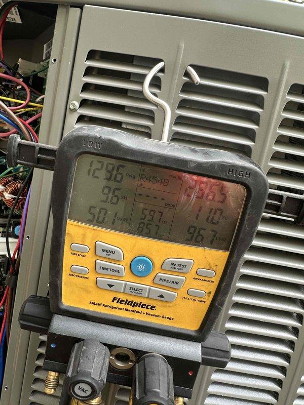 Completed installation of a 2-ton, 19 SEER heat pump system with matching air handler in residential mechanical closet. Installed Lennox air handler unit with proper refrigerant line connections, galvanized ductwork integration, and PVC condensate drain line with appropriate trap configuration. System was charged, tested, and verified operational using digital manifold gauges to ensure proper refrigerant pressures and temperatures across all components.