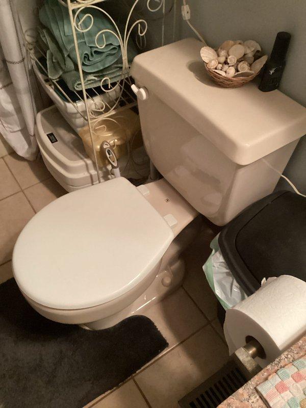 Completed installation of two comfort-height toilets in residential bathroom to accommodate accessibility needs following customer's hip replacement surgery. Removed existing standard-height fixtures and installed ADA-compliant toilets with proper wax ring seals, supply line connections, and floor mounting. Verified all plumbing connections for leaks, ensured proper flush operation, and tested water supply valves for both units.