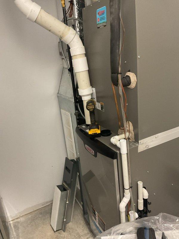 Completed annual Platinum Level planned maintenance on dual HVAC system installation. Performed comprehensive inspection and servicing of both units, including Lennox furnace and air handler components. Replaced 25x25x5 and 16x25x5 filters, inspected condensate pump operation, verified proper drainage through PVC condensate lines, and checked refrigerant line insulation integrity. Examined all electrical connections, tested safety controls, and confirmed proper airflow through metallic ductwork. Verified water heater and mechanical room components for clearance and safety compliance. All systems operating within manufacturer specifications upon completion of first annual maintenance visit.