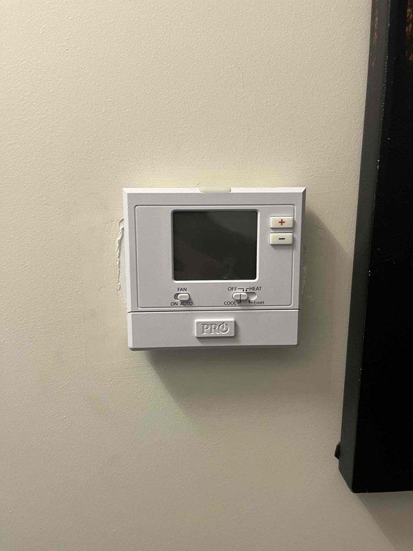 Responded to cooling system complaint with 6-degree temperature differential between thermostat setpoint and actual room temperature. Upon inspection, diagnosed faulty thermostat temperature sensor causing inaccurate readings and preventing proper system cycling. Removed existing programmable thermostat, verified proper wire terminations at R, C, G, Y, W/E terminals, and installed replacement unit. Tested system operation through complete cooling cycle, confirmed accurate temperature sensing, and verified unit now achieving desired setpoint. System restored to proper operation.