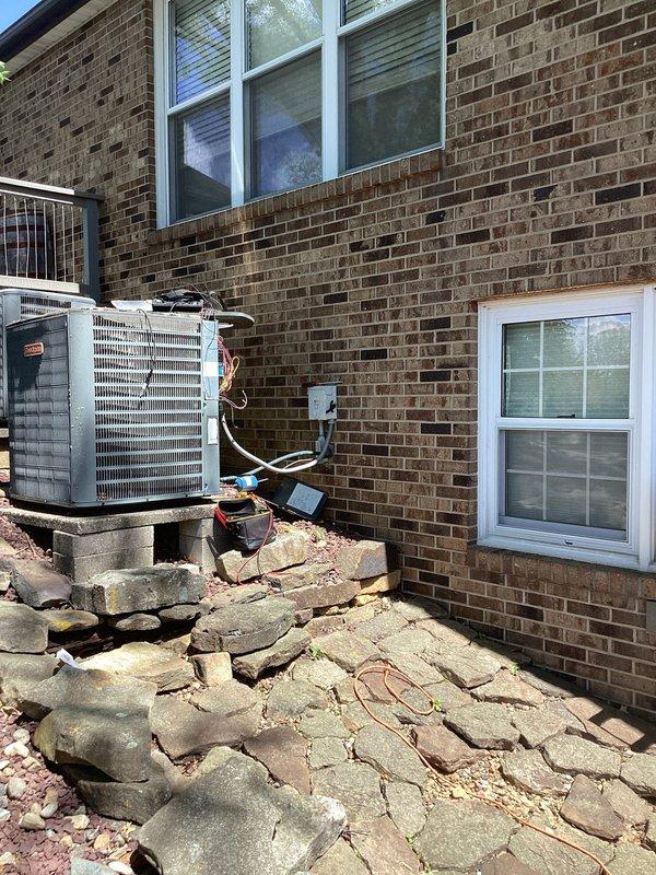 Responded to no cooling complaint on 20+ year old residential HVAC system with thermostat reading 74°F despite setpoint of 68°F and reported water accumulation at base of unit. Upon arrival, performed comprehensive system diagnostic including visual inspection of both outdoor condenser units and indoor air handler. Confirmed adequate airflow through supply vents and assessed refrigerant lines for proper insulation and potential leak points. Evaluated condensate drain system to identify source of water pooling at equipment base, checking for blockages in drain line and proper pan drainage. Inspected evaporator coil area for ice formation or frost buildup that could indicate airflow restriction or refrigerant issues. Checked electrical connections, capacitor function, and contactor operation on outdoor units. Measured temperature differential across evaporator coil and assessed system superheat and subcooling values to determine refrigerant charge status. Given the age of the system exce