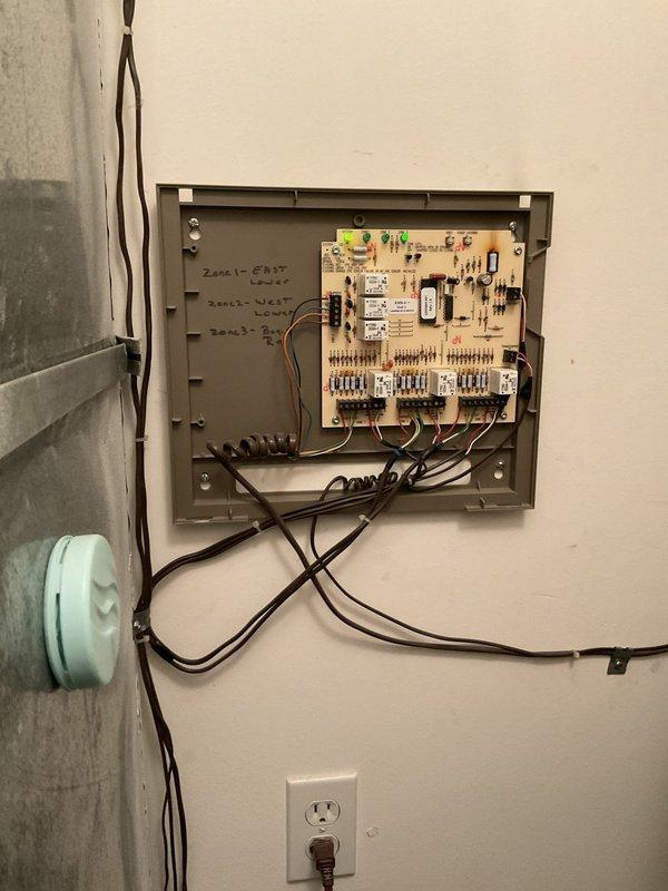 Responded to no-cool complaint on multi-zone system serving upstairs and downstairs areas. Diagnosed zoning control issue affecting upstairs zone only, with downstairs zone operating normally. Inspected zone control panel, damper actuators, and thermostat settings; verified proper system operation and airflow distribution to resolve temperature differential between zones.