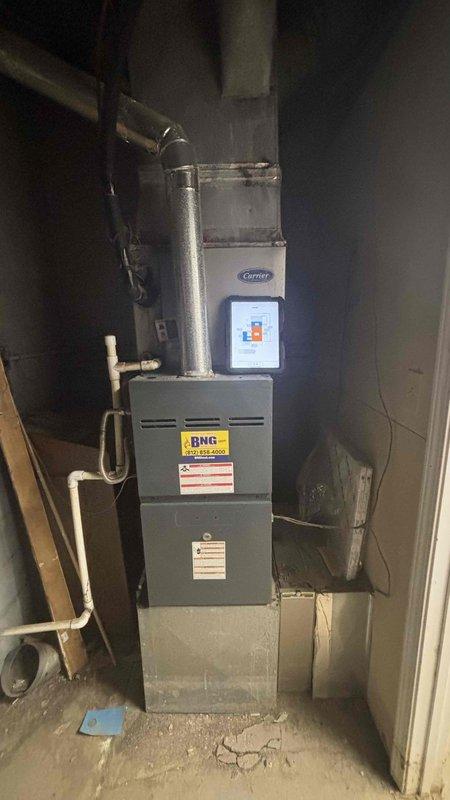 Completed comprehensive HVAC system replacement estimate for municipal contractor requiring outdoor condensing unit replacement. Verified existing Carrier furnace system non-operational with customer declining repair option in favor of full outdoor unit replacement. Documented existing basement installation including furnace configuration, venting system, PVC condensate drainage, and current mechanical room layout through photographic documentation to facilitate accurate equipment specifications and installation planning for municipal approval process.