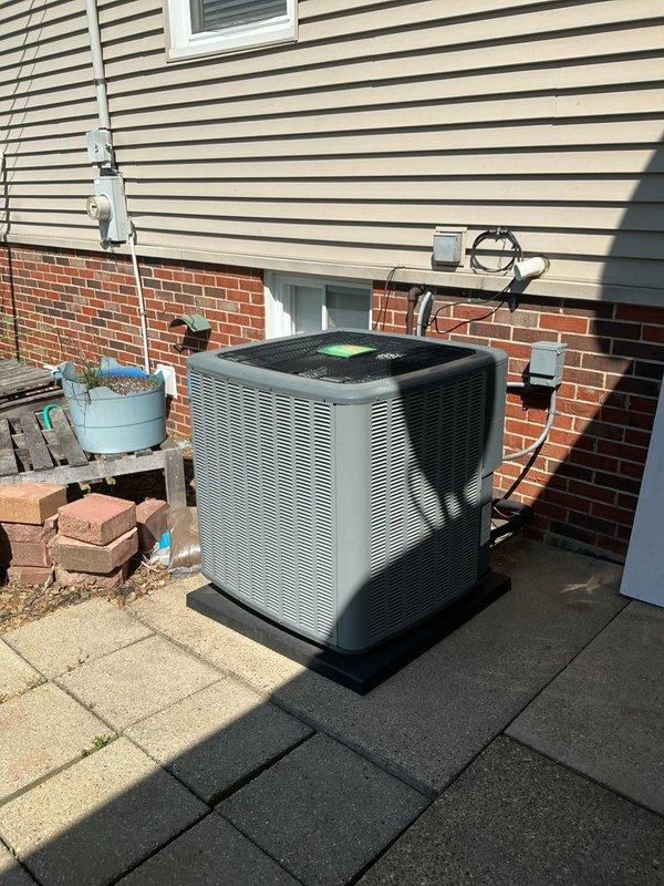 Responded to no cooling complaint on five-year-old residential air conditioning system. Upon arrival, performed comprehensive diagnostic evaluation of both outdoor condensing unit and indoor air handler. Inspected refrigerant lines, electrical connections, and verified no ice formation on evaporator coil. Documented equipment condition with photos showing outdoor condenser unit properly positioned on pad with adequate clearance, and indoor air handler installation in utility area with associated ductwork and drainage systems intact. System components appeared to be in good physical condition with normal wear patterns for age. Completed diagnostic assessment and provided findings to customer regarding cooling issue resolution.