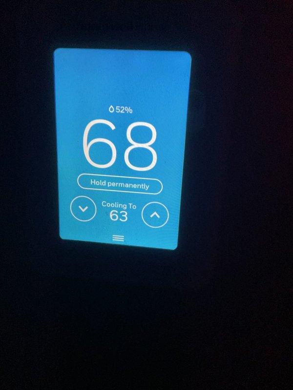 Completed annual platinum-level preventive maintenance on single HVAC system. Verified thermostat operation showing 68°F set point with cooling mode active to 63°F and 52% humidity level. Measured system amperage at 0.07A using clamp meter on outdoor unit, confirming proper electrical operation. Replaced both air filters per specifications (14x14x1 and 14x30x1). All components inspected and operating within normal parameters.